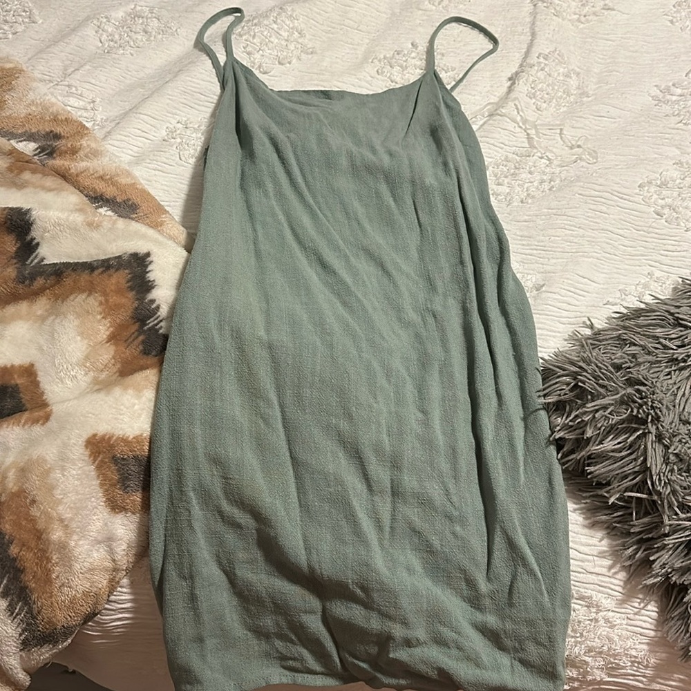 A slip dress, beautiful green color, open back, never been worn